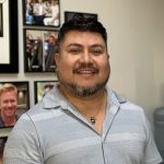 a man smiling at camera