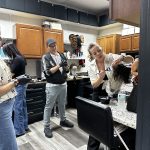 a group of people in a salon