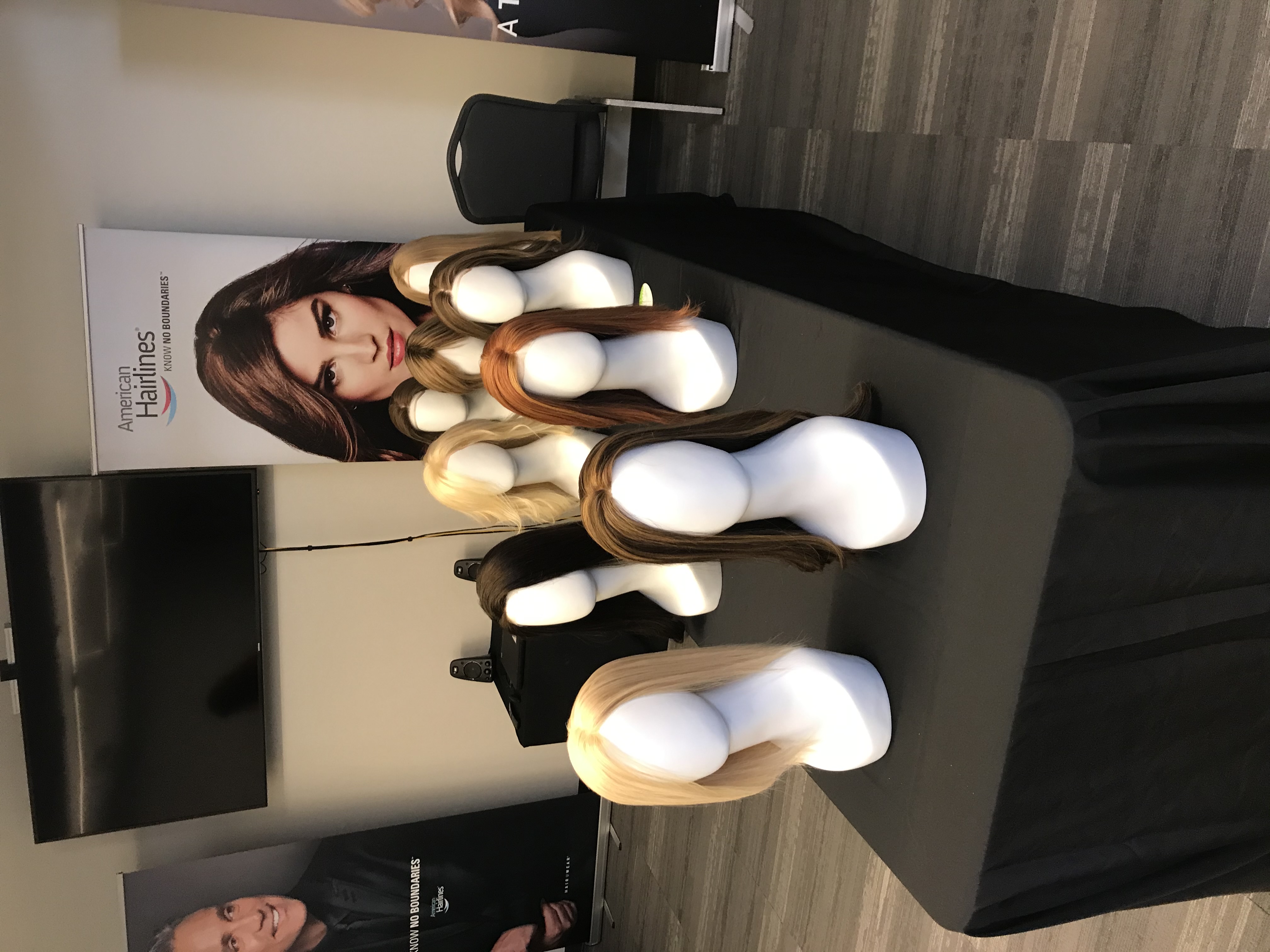 a mannequins with hair systems on a table