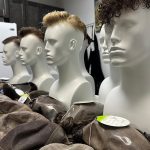 a group of mannequins with wigs