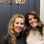 two women smiling at the camera